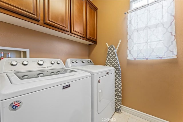 28549 Oakhurst Way, Temecula, CA 92591 - washroom featuring cabinet space, washer and clothes dryer, and light tile patterned flooring