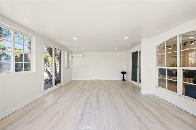 647 Magnolia Ave, Brea, CA 92821 - unfurnished living room with a wall unit AC, light wood finished floors, and recessed lighting