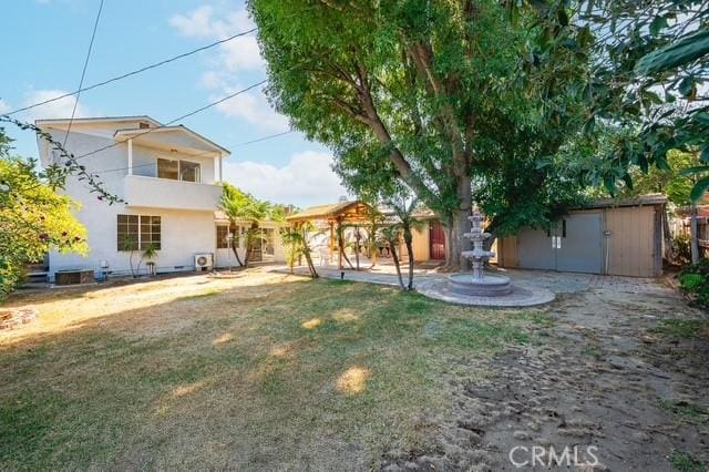 647 Magnolia Ave, Brea, CA 92821 - view of yard featuring a storage unit