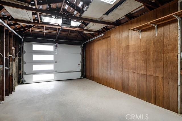 647 Magnolia Ave, Brea, CA 92821 - garage featuring wood walls and a garage door opener