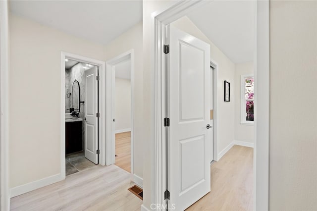 647 Magnolia Ave, Brea, CA 92821 - corridor with light wood-type flooring and baseboards