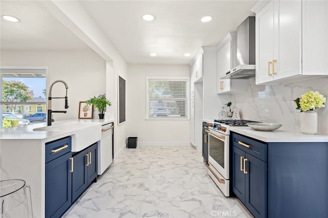 647 Magnolia Ave, Brea, CA 92821 - kitchen with high end stove, wall chimney exhaust hood, blue cabinets, dishwasher, and recessed lighting