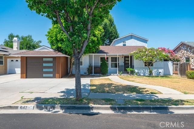 647 Magnolia Ave, Brea, CA 92821 - ranch-style home featuring concrete driveway and a garage