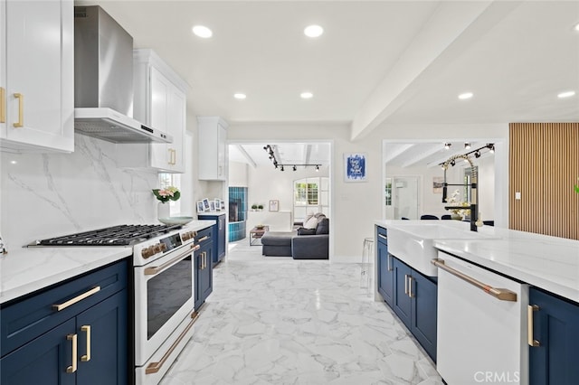 647 Magnolia Ave, Brea, CA 92821 - kitchen featuring white appliances, wall chimney exhaust hood, blue cabinetry, white cabinets, and open floor plan