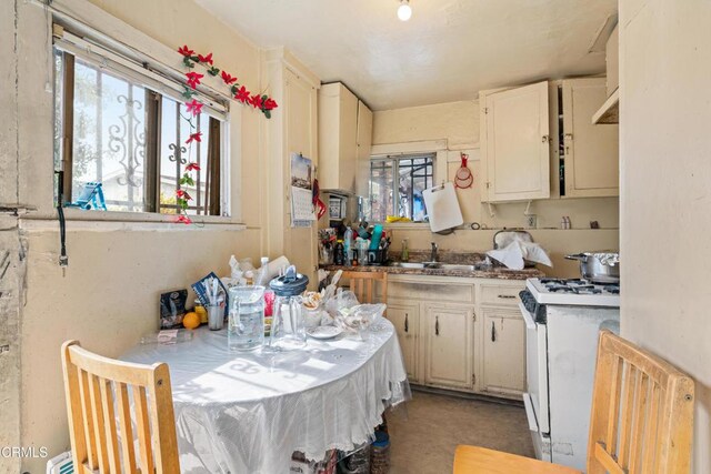 1156 S Alma Ave, Los Angeles, CA 90023 - kitchen featuring white gas range and a sink