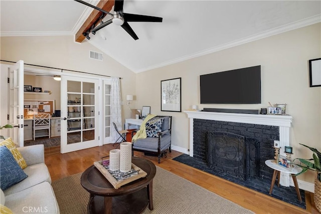 20108 Wayne Ave, Torrance, CA 90503 - living room featuring french doors, a ceiling fan, wood finished floors, crown molding, and a fireplace