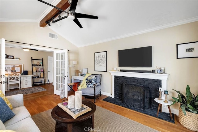 20108 Wayne Ave, Torrance, CA 90503 - living room featuring ceiling fan, ornamental molding, wood finished floors, french doors, and a brick fireplace