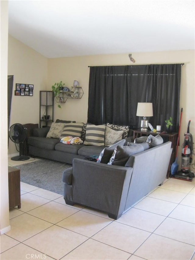 235 E 7th St, San Jacinto, CA 92583 - living area featuring tile patterned flooring and vaulted ceiling