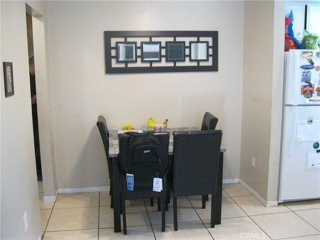 235 E 7th St, San Jacinto, CA 92583 - tiled dining area with baseboards