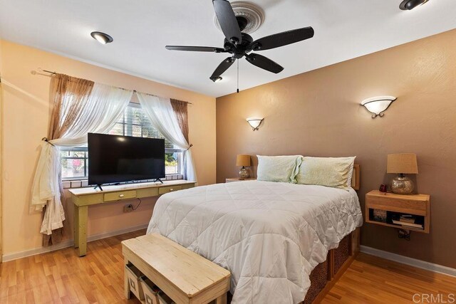 10048 Waynecrest Ln, Santee, CA 92071 - bedroom featuring multiple windows and light wood-type flooring