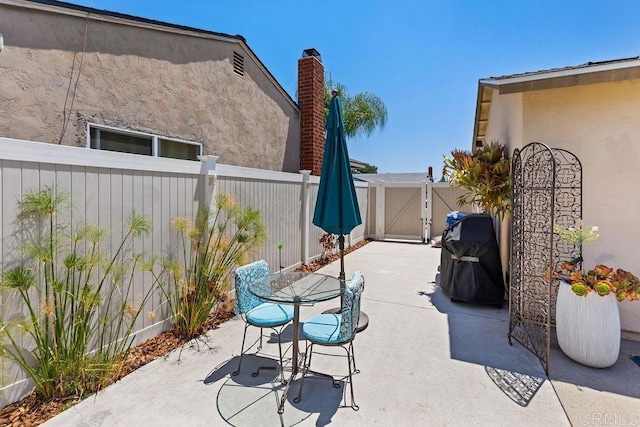 10048 Waynecrest Ln, Santee, CA 92071 - fenced backyard featuring a gate, a patio, and grilling area