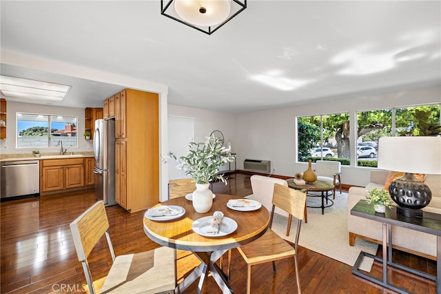2133 Via Puerta Unit A, Laguna Woods, CA 92637 - dining room featuring dark wood-type flooring and an AC wall unit