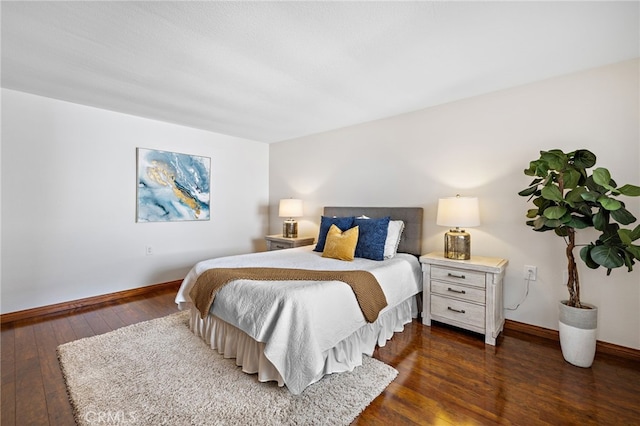 2133 Via Puerta Unit A, Laguna Woods, CA 92637 - bedroom featuring wood-type flooring and baseboards