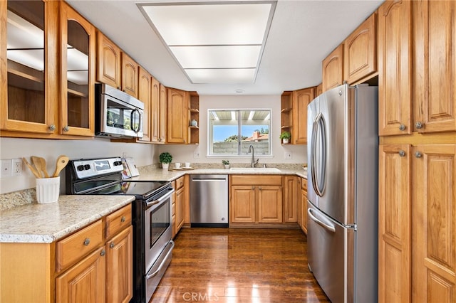 2133 Via Puerta Unit A, Laguna Woods, CA 92637 - kitchen featuring stainless steel appliances, open shelves, dark wood-type flooring, and light countertops