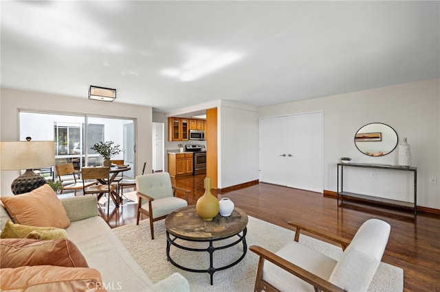 2133 Via Puerta Unit A, Laguna Woods, CA 92637 - living room with dark wood-style floors