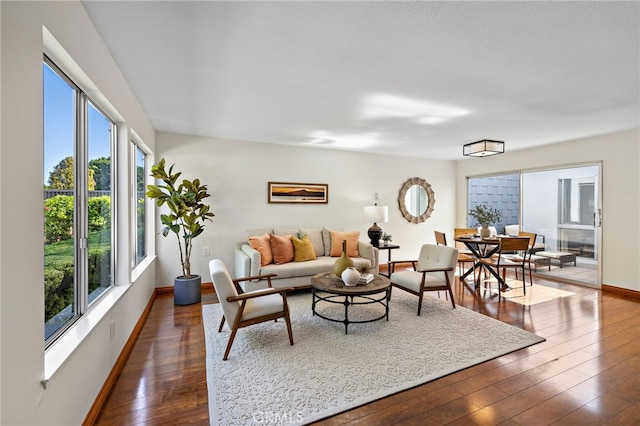 2133 Via Puerta Unit A, Laguna Woods, CA 92637 - living room with healthy amount of natural light and dark wood-type flooring