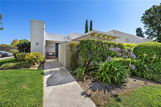 2133 Via Puerta Unit A, Laguna Woods, CA 92637 - view of front of home featuring a gate