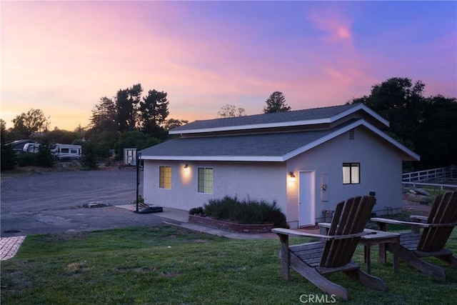320 Casa Real Pl, Nipomo, CA 93444 - back of house at dusk with stucco siding and roof with shingles