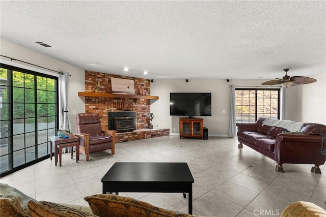 320 Casa Real Pl, Nipomo, CA 93444 - living area with a textured ceiling, tile patterned flooring, healthy amount of natural light, and ceiling fan
