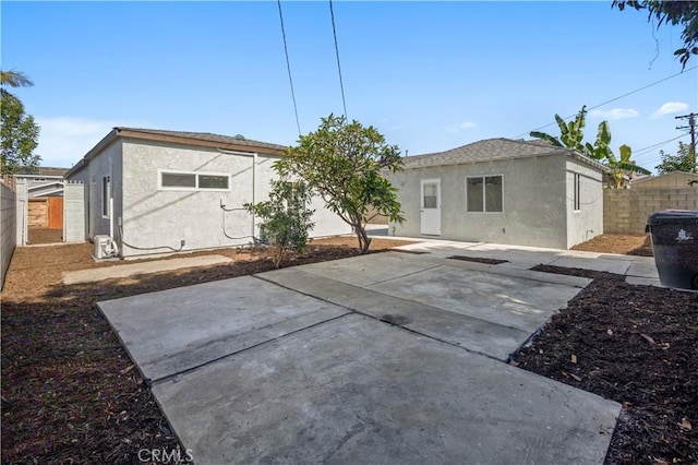 4251 Gundry Ave, Long Beach, CA 90807 - back of house featuring stucco siding, a fenced backyard, and a patio area