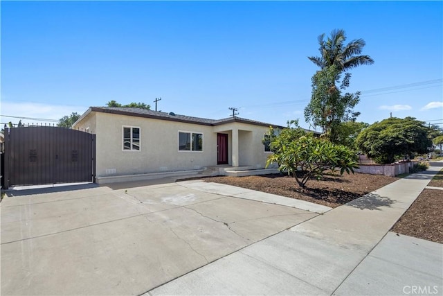 4251 Gundry Ave, Long Beach, CA 90807 - single story home with stucco siding, a gate, and crawl space