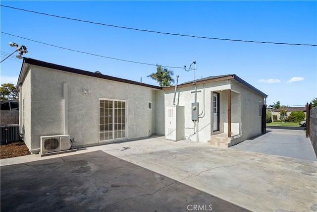 4251 Gundry Ave, Long Beach, CA 90807 - rear view of house with stucco siding and a patio area