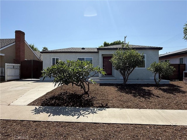 4251 Gundry Ave, Long Beach, CA 90807 - view of front facade with stucco siding and a gate