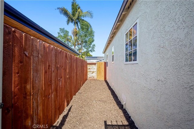 4251 Gundry Ave, Long Beach, CA 90807 - view of side of home featuring stucco siding