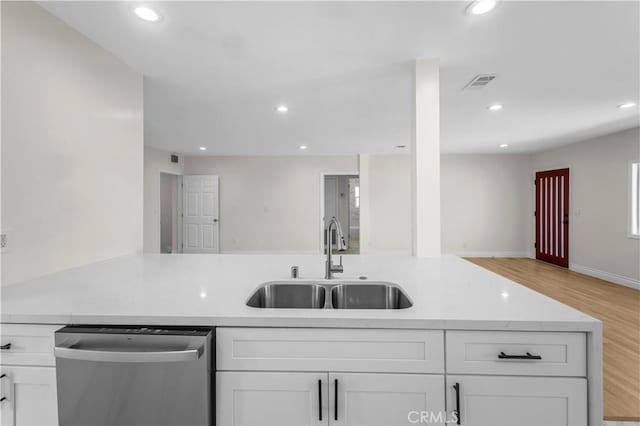 4251 Gundry Ave, Long Beach, CA 90807 - kitchen featuring stainless steel dishwasher, recessed lighting, white cabinetry, open floor plan, and light wood-style floors