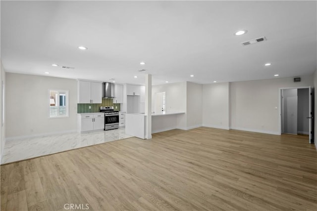 4251 Gundry Ave, Long Beach, CA 90807 - unfurnished living room with light wood-type flooring and recessed lighting