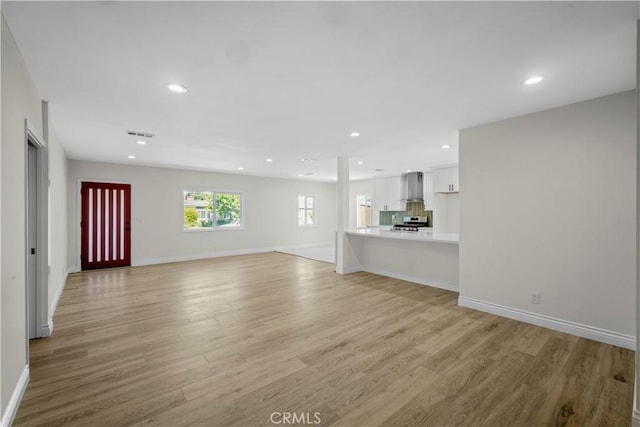 4251 Gundry Ave, Long Beach, CA 90807 - unfurnished living room featuring light wood-type flooring and recessed lighting