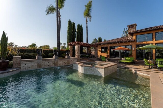 25492 Spotted Pony Ln, Laguna Hills, CA 92653 - view of swimming pool with area for grilling, a pool with connected hot tub, and a patio area