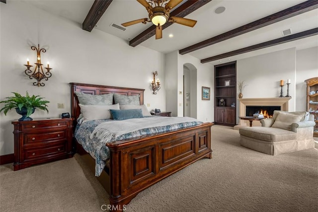 25492 Spotted Pony Ln, Laguna Hills, CA 92653 - bedroom featuring carpet flooring, arched walkways, beamed ceiling, a lit fireplace, and recessed lighting