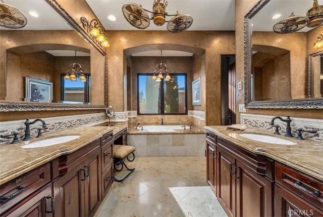 25492 Spotted Pony Ln, Laguna Hills, CA 92653 - bathroom with a chandelier, two vanities, and a garden tub