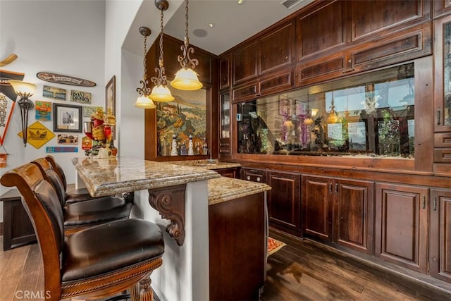 25492 Spotted Pony Ln, Laguna Hills, CA 92653 - bar area with dark wood-style flooring and pendant lighting