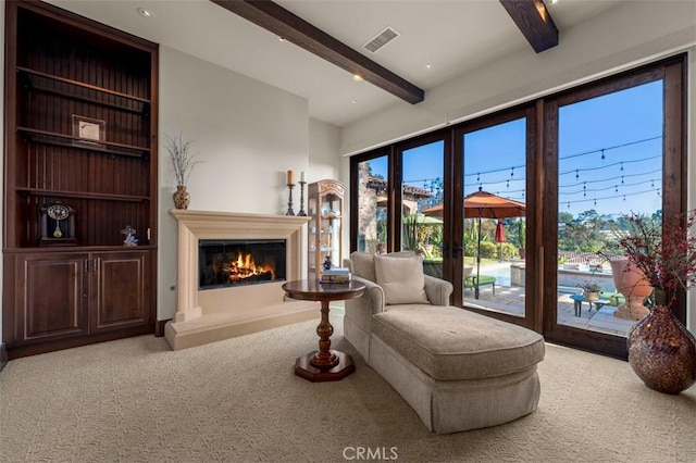 25492 Spotted Pony Ln, Laguna Hills, CA 92653 - sitting room featuring carpet, beamed ceiling, a glass covered fireplace, and french doors