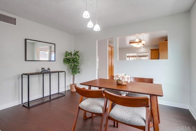 911 S Citrus Ave, Escondido, CA 92027 - dining room featuring dark wood-style flooring and baseboards