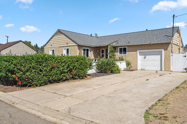 3443 Trophy Dr, La Mesa, CA 91941 - ranch-style house with stucco siding, driveway, an attached garage, and roof with shingles