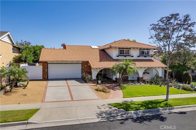 1276 Sao Paulo Ave, Placentia, CA 92870 - mediterranean / spanish-style home with stucco siding, a tiled roof, driveway, and an attached garage