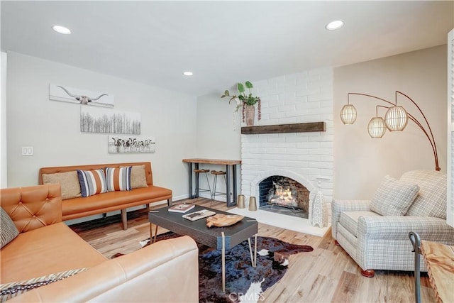 1276 Sao Paulo Ave, Placentia, CA 92870 - living room with wood finished floors, a fireplace, and recessed lighting