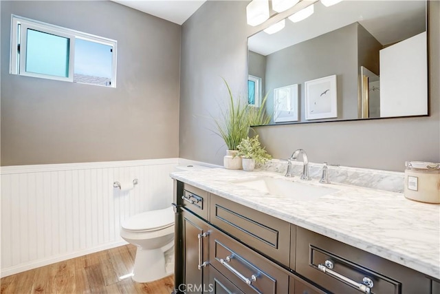1276 Sao Paulo Ave, Placentia, CA 92870 - bathroom featuring vanity, a wainscoted wall, wood finished floors, and healthy amount of natural light