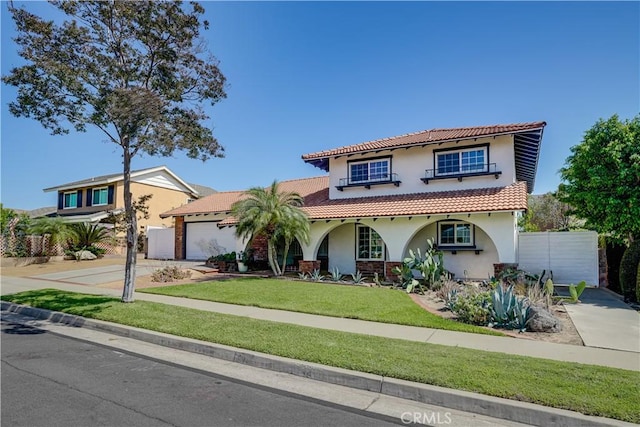 1276 Sao Paulo Ave, Placentia, CA 92870 - mediterranean / spanish-style home with concrete driveway, stucco siding, a garage, and a tiled roof
