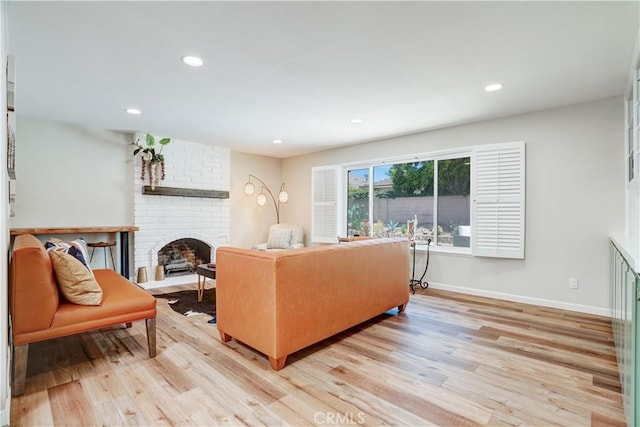 1276 Sao Paulo Ave, Placentia, CA 92870 - living room featuring a brick fireplace, light wood-style flooring, and recessed lighting