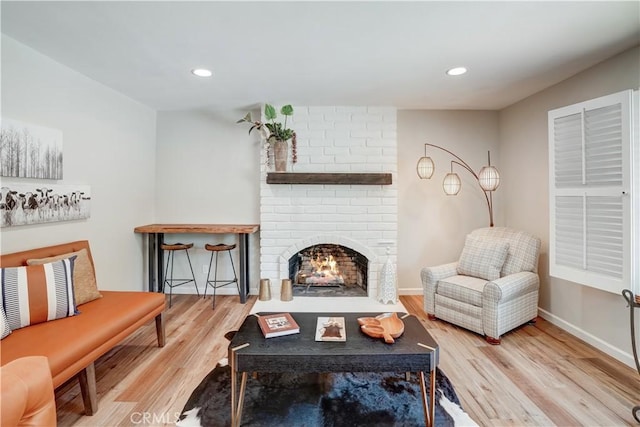 1276 Sao Paulo Ave, Placentia, CA 92870 - living room with wood finished floors, recessed lighting, and a brick fireplace