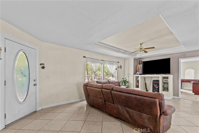 27679 Junipero Rd, Menifee, CA 92585 - living area with light tile patterned flooring, a tray ceiling, ceiling fan, and a textured ceiling