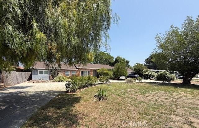 984 E Lynwood Dr, San Bernardino, CA 92404 - view of front facade with concrete driveway
