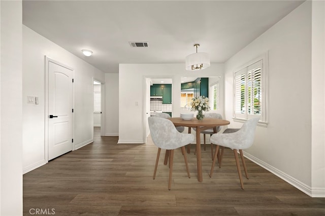 2871 Adriatic Ave, Long Beach, CA 90810 - dining area featuring baseboards and wood finished floors