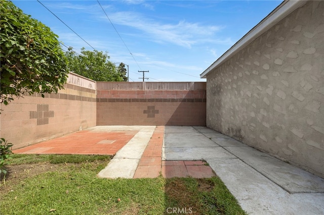 2871 Adriatic Ave, Long Beach, CA 90810 - fenced backyard featuring a patio