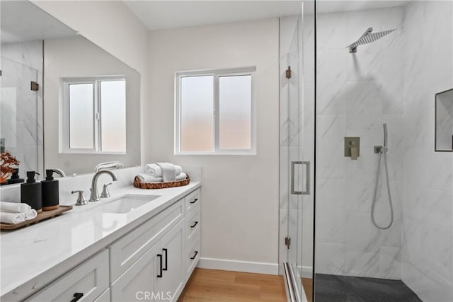 14867 Roxton Ave, Gardena, CA 90249 - full bathroom with vanity, a marble finish shower, healthy amount of natural light, and wood finished floors