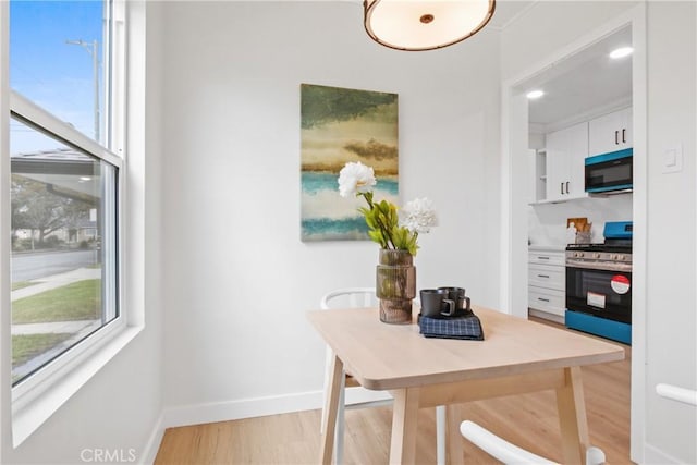 14867 Roxton Ave, Gardena, CA 90249 - dining area featuring light wood finished floors and a desk